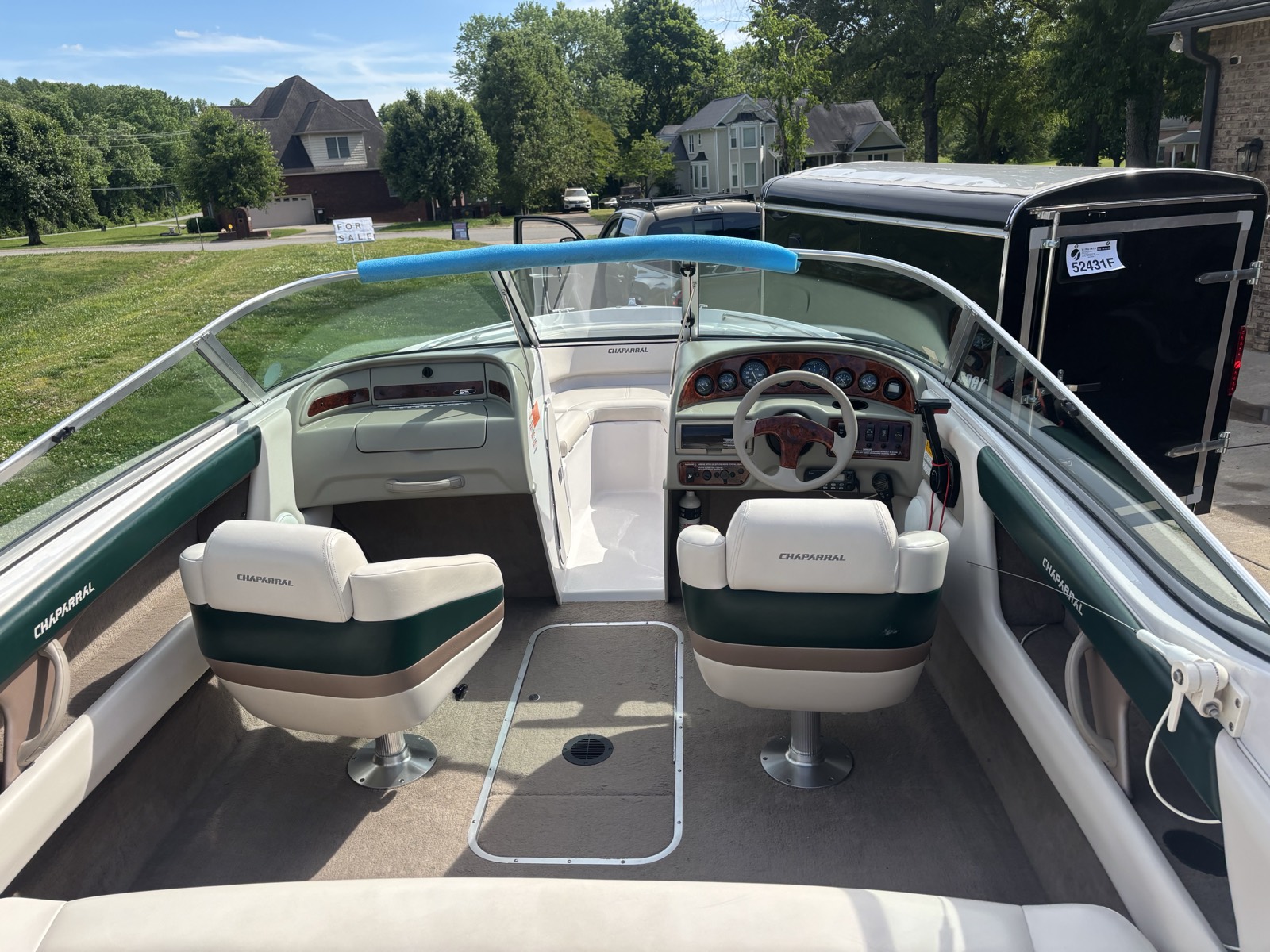 Chaparral boat interior after full marine detail — clean vinyl, glass, and UV-protected trim
