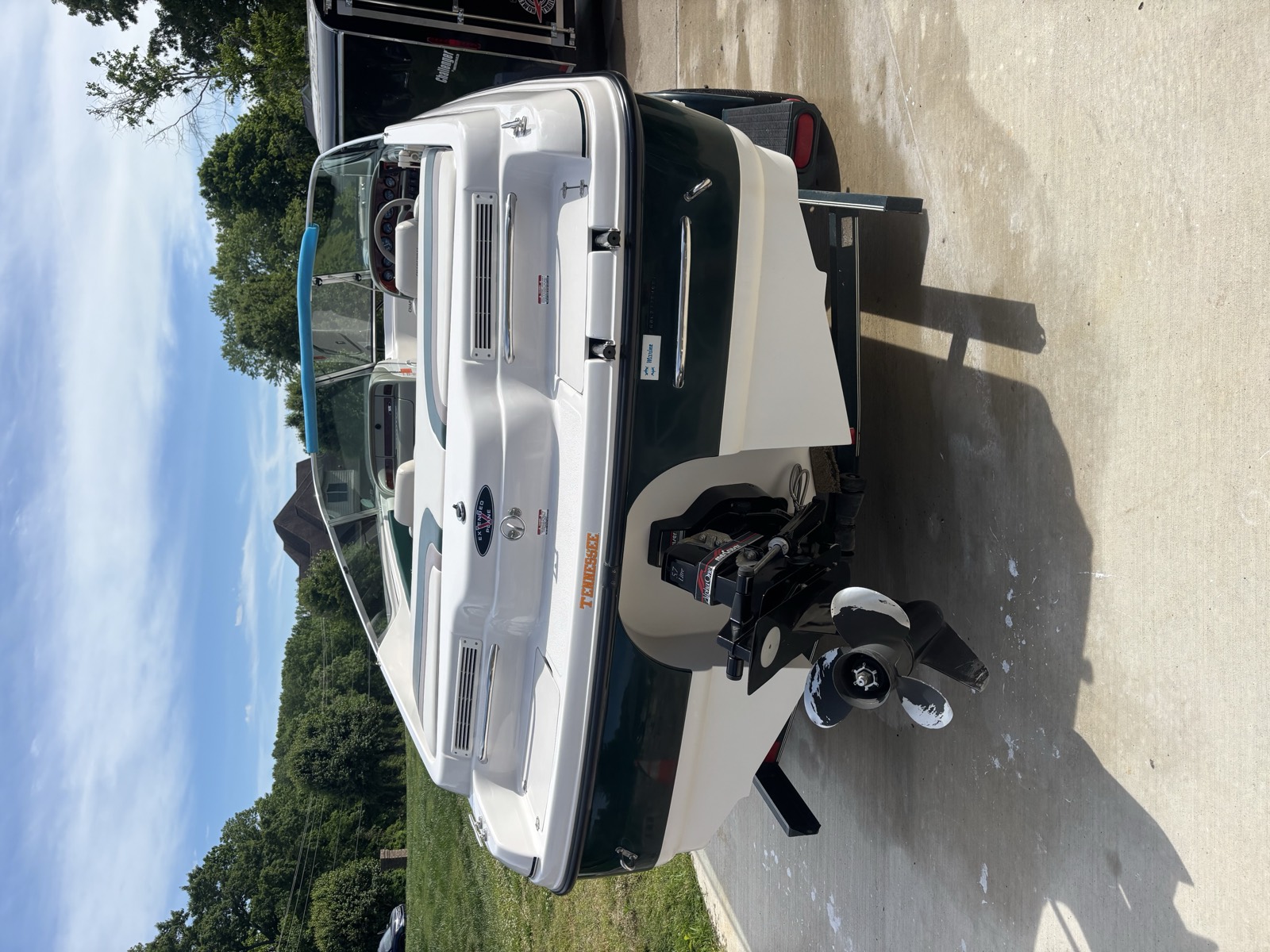 Stern and swim platform of a Chaparral after detailing — waterline cleaned and brightwork polished