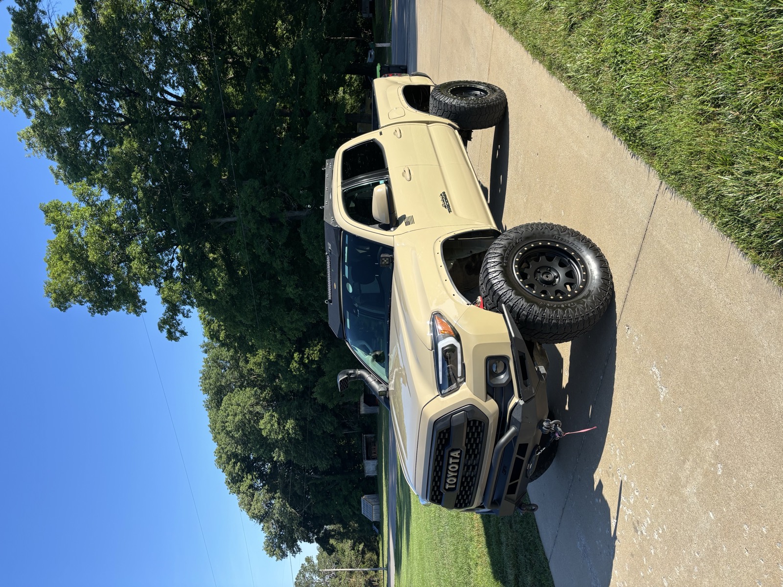 Tan Toyota Tacoma TRD Pro after a full detail near Fort Campbell — clean bodywork and dressed tires