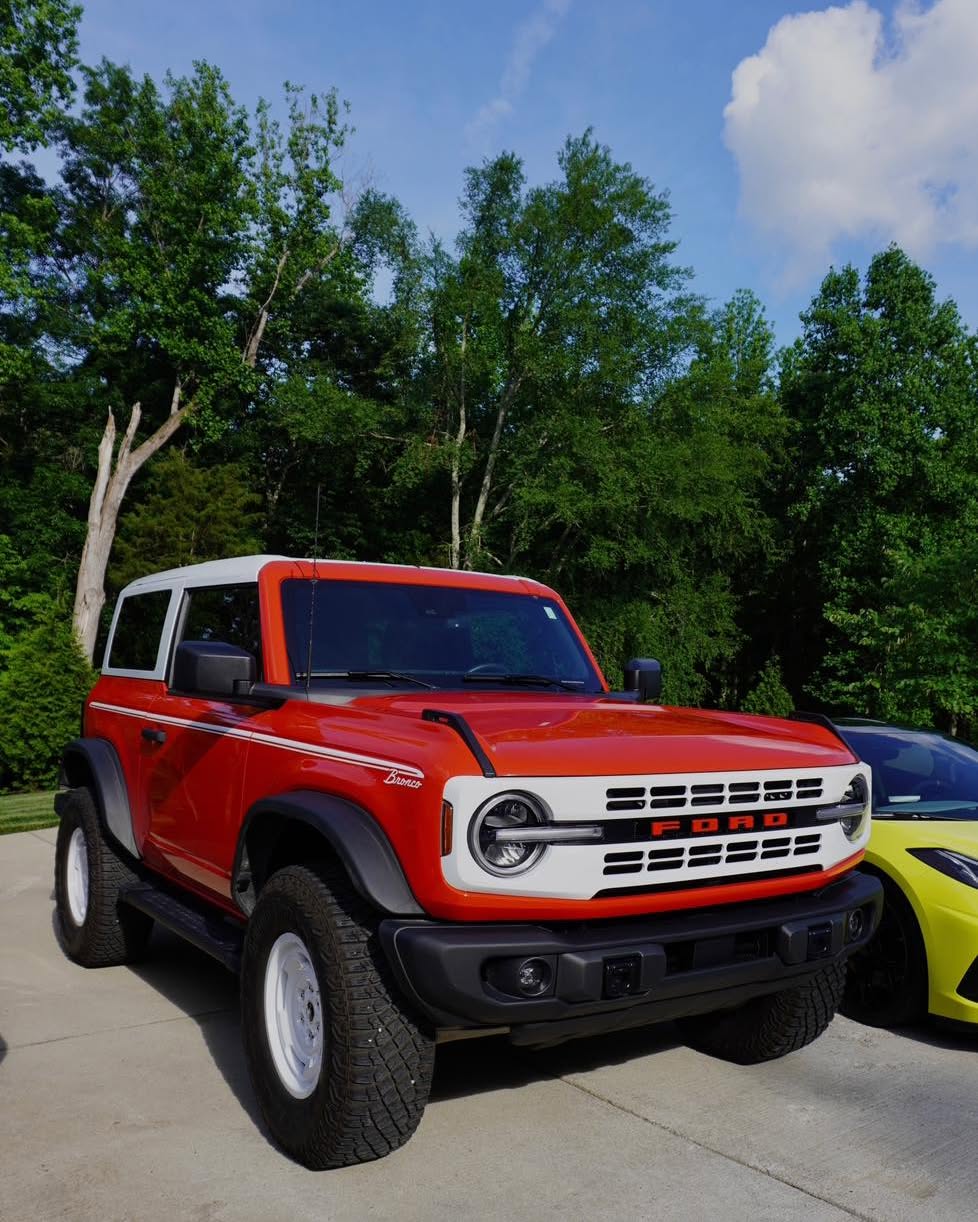 Red Ford Bronco Badlands two-door after exterior detail — bright finish, tire dressing, clean wheels